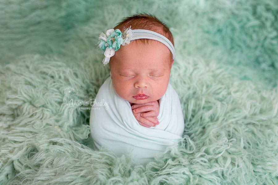 Newborn Potato Sack Pose, minty greens, baby girl