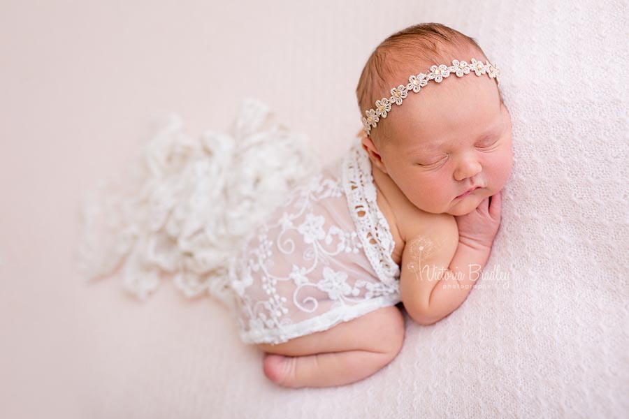 newborn photography on pale pink backdrop