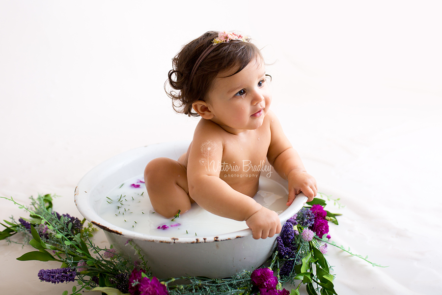 side lit milk bath image, whites, purples and greens