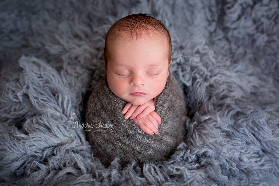 grey flokati newborn potato sack pose