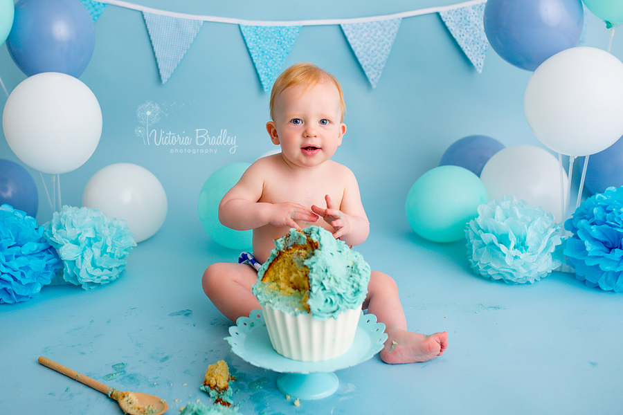 baby boy cake smash session with blue giant cupcake