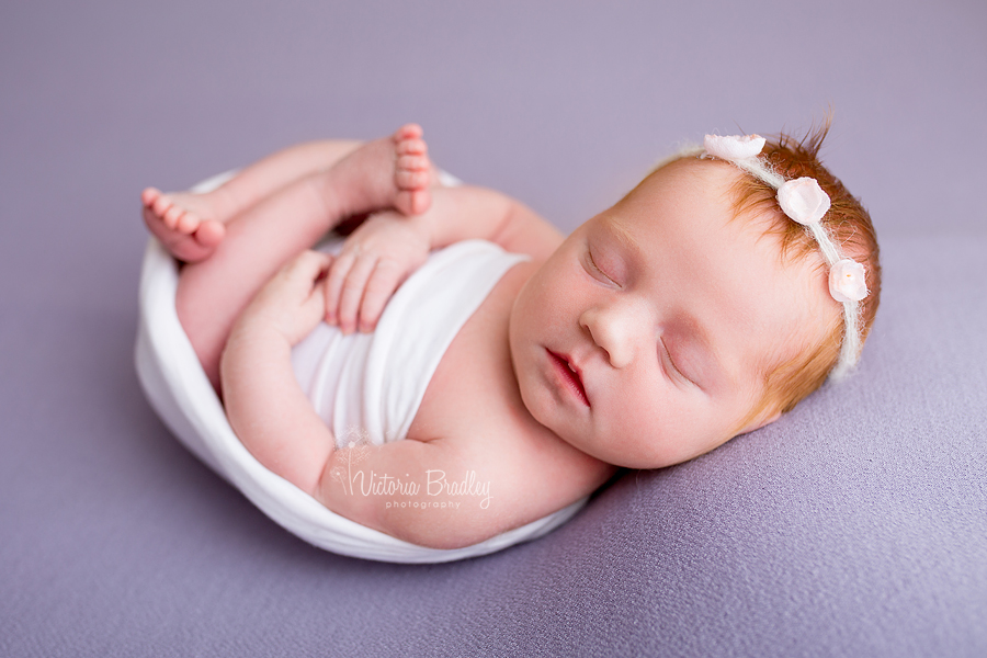 newborn baby girl photography nottinghamshire on lilac backdrop