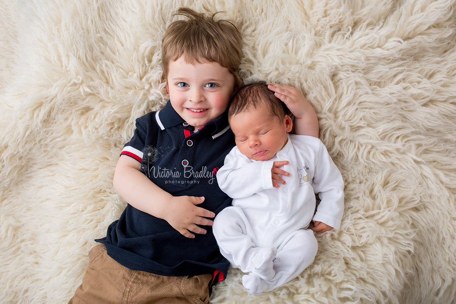 baby newborn with 3 years old sibling photography session in Nottinghamshire