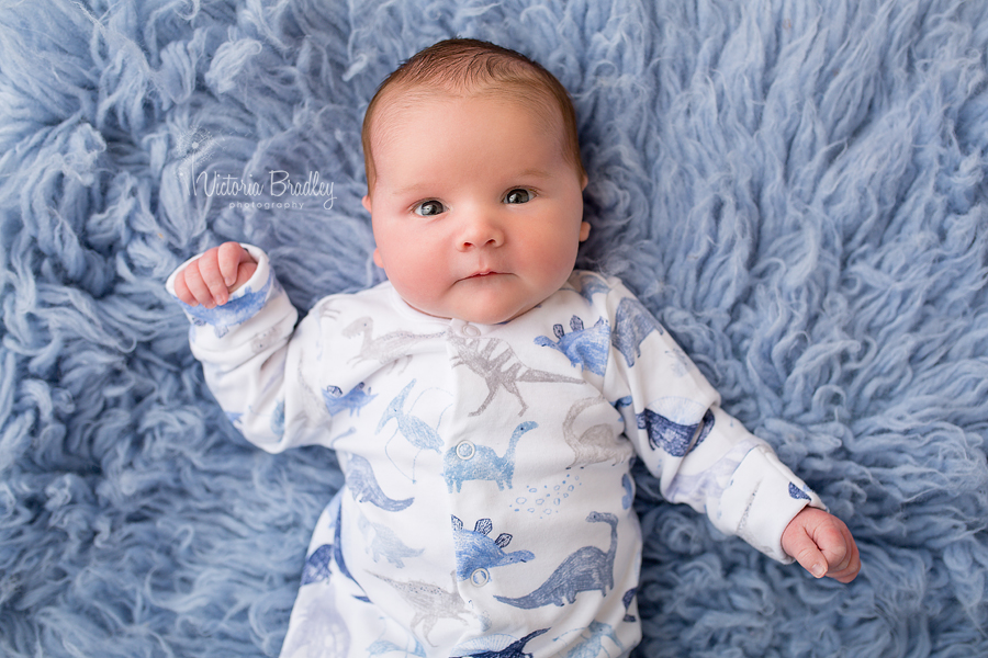 baby bot on blue flokati rug