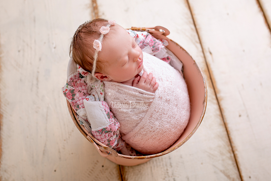 wrapped newborn photography baby in bucket