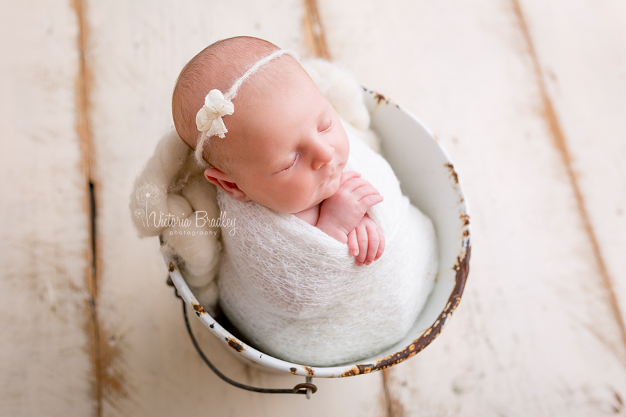 newborn baby girl photography in white bucket