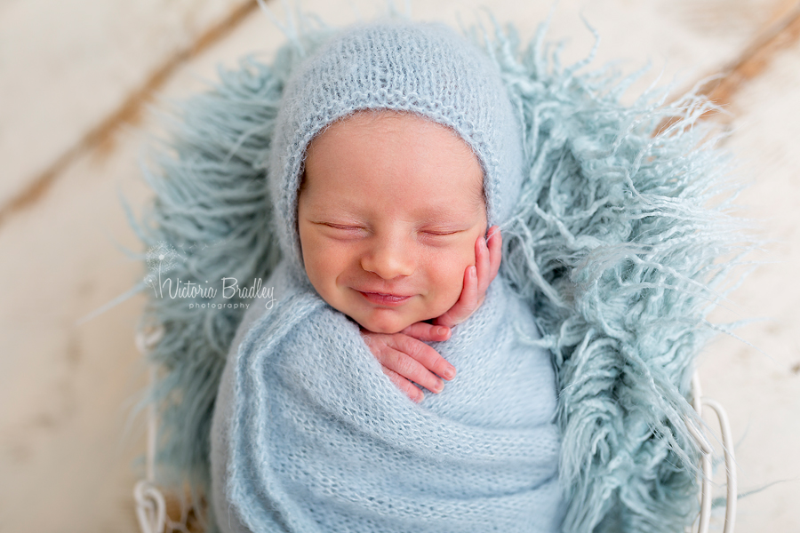 wrapped newborn baby boy photographer, duck egg blue colours