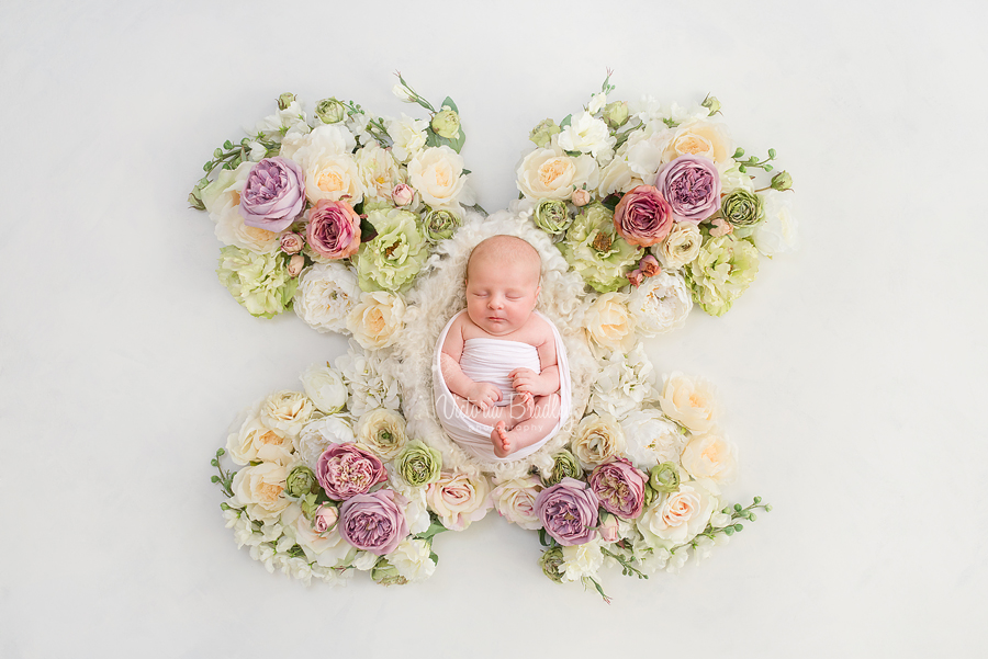 newborn baby girl photography on flower butterfly backdrop