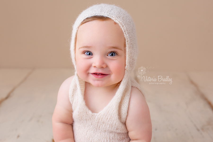 sitter baby with knitted cream hoodie