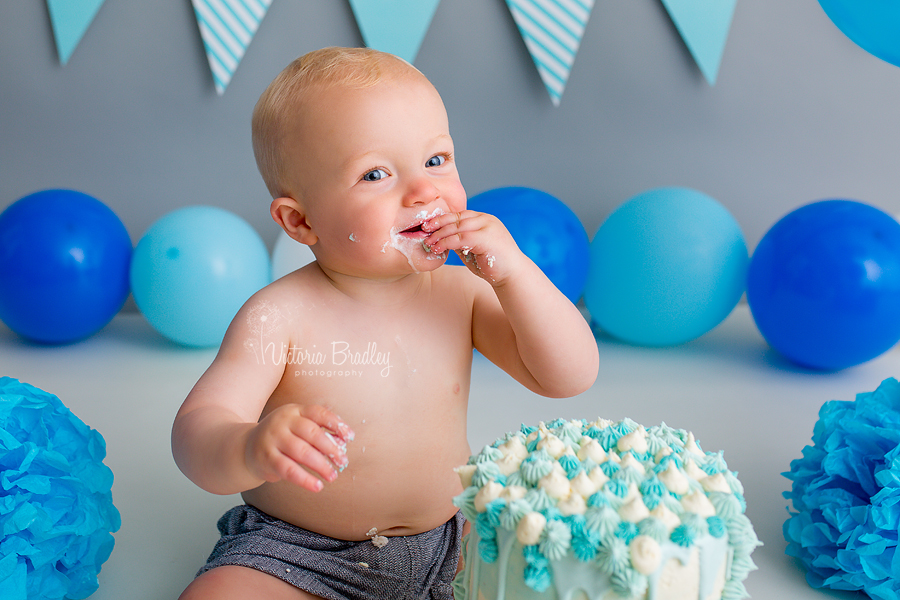 cake smash birthday photography session greys, blues whites