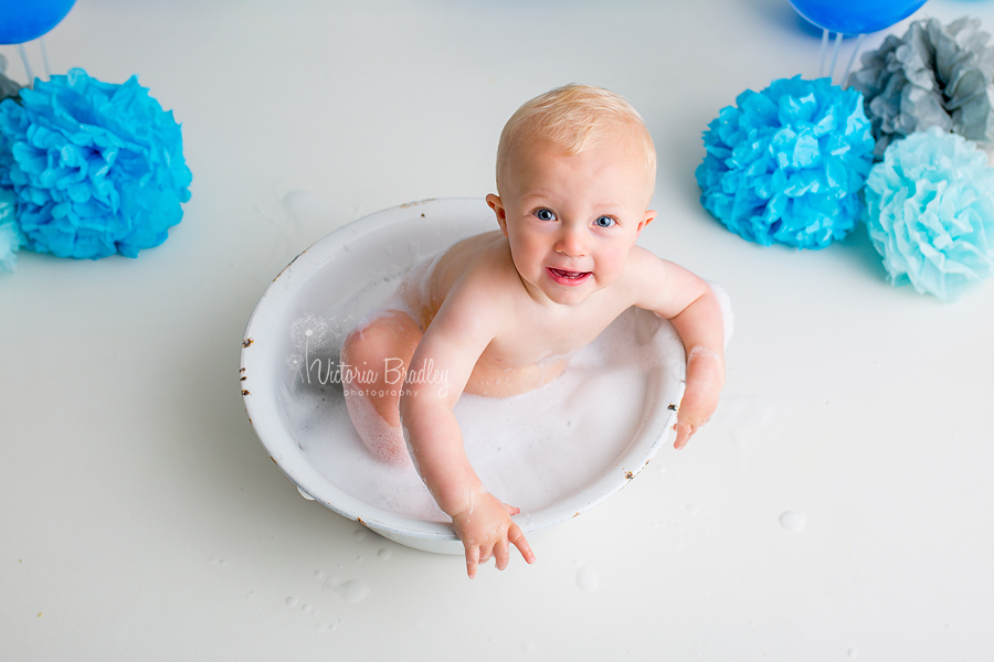 baby boy cake smash photo session blues and greys, white enamel bath tub