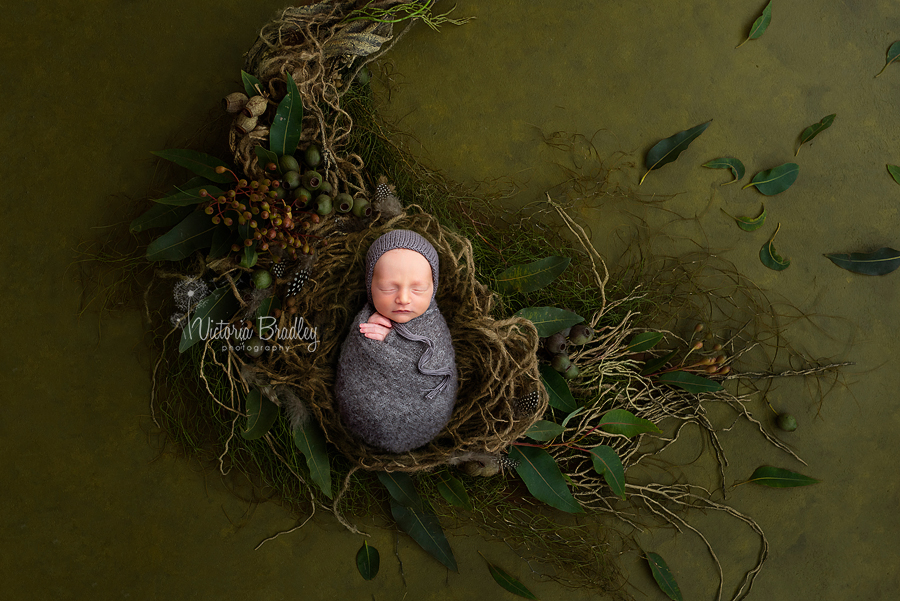 wrapped newborn in leaf basket