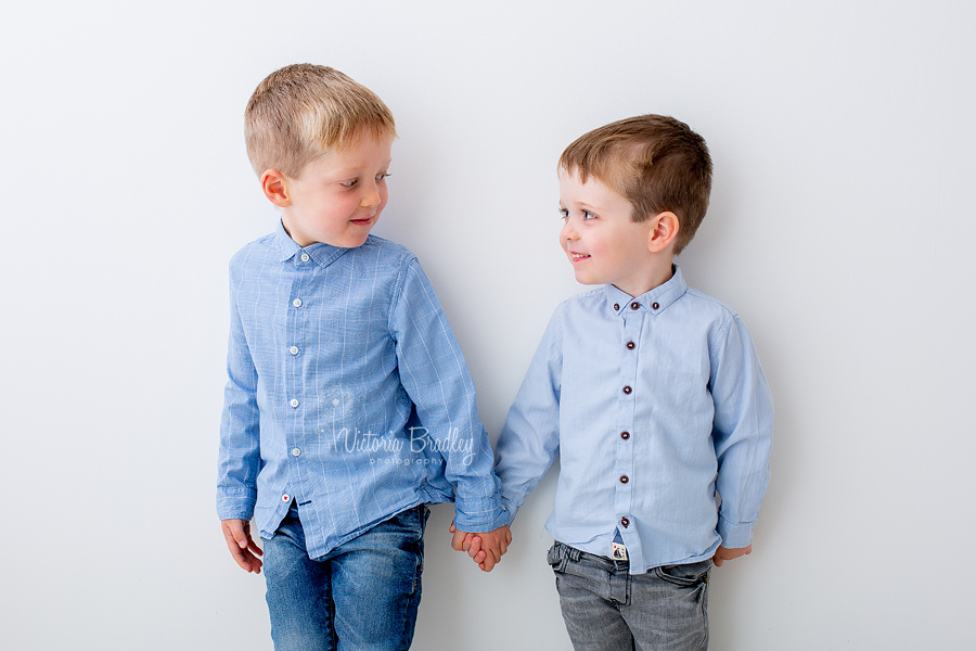 sibling photography white studio boys