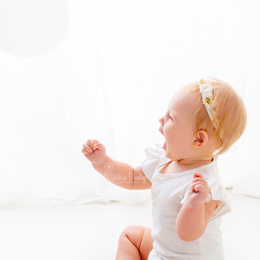 baby girl white cake smash with white balloon