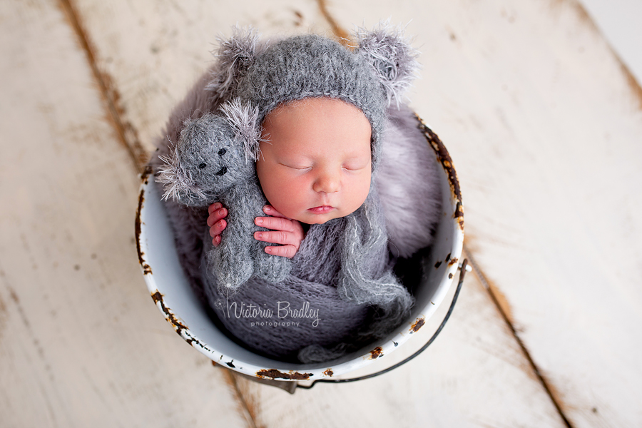 baby in koala hat with tiny koala bear