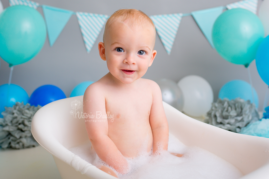 baby boy in mini claw foot bath