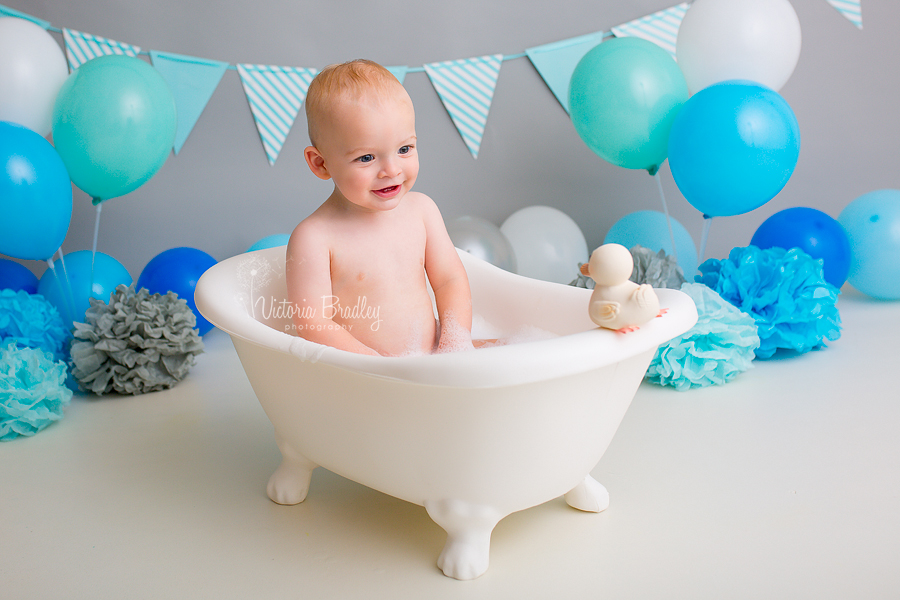 baby boy in claw foot bath cake smash