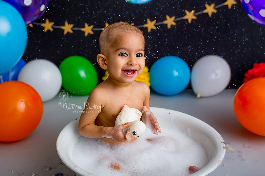 baby boy space cake smash in bath tub