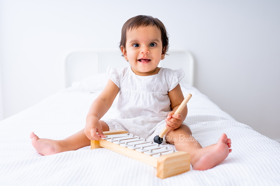 white bed baby girl natural photography