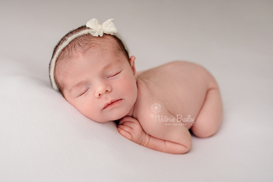 newborn baby photography on white backdrop