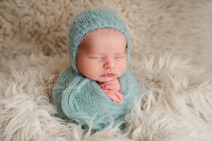 potato sack pose newborn photography sage green fluffy wrap