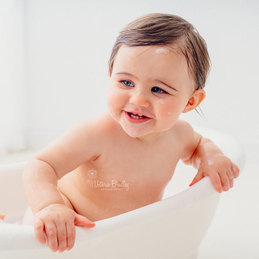 baby girl white bath tub