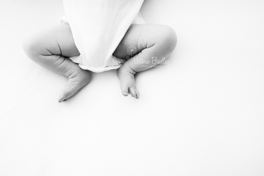 newborn baby leg black and white