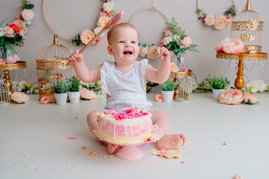 baby with wooden spoon cake smash