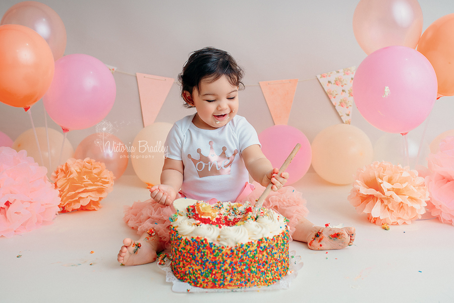 baby girl peach and pale pink cake smash