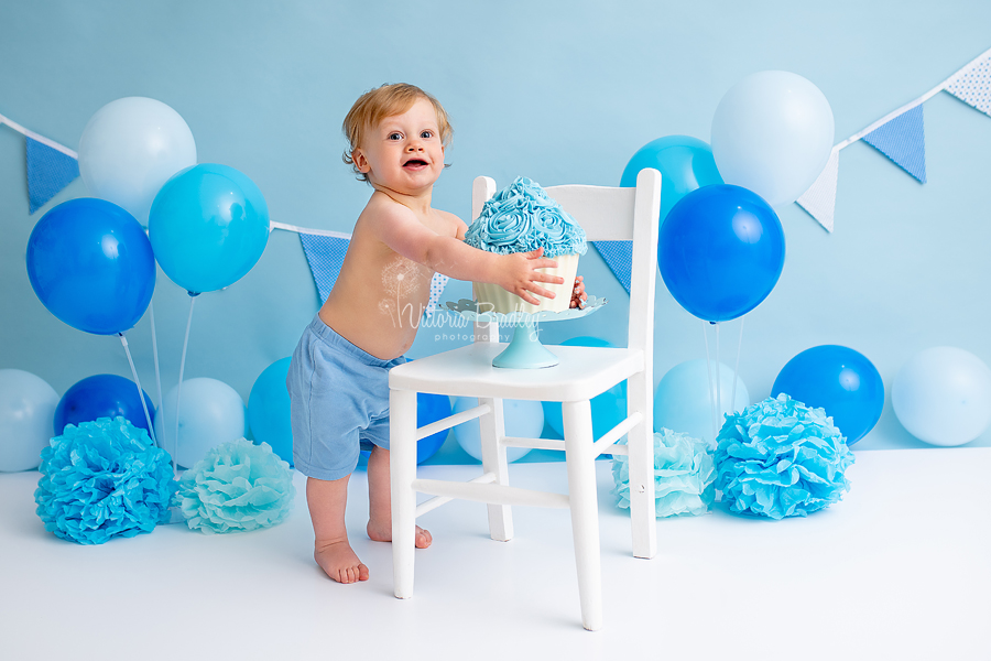 baby boy blues cake smash with white chair