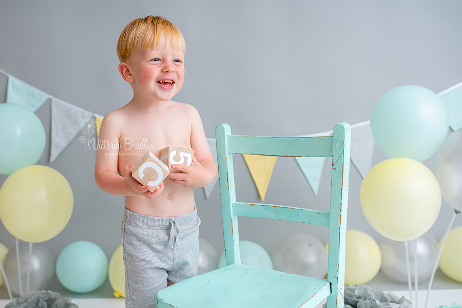 aqua, yellow and grey cake smash