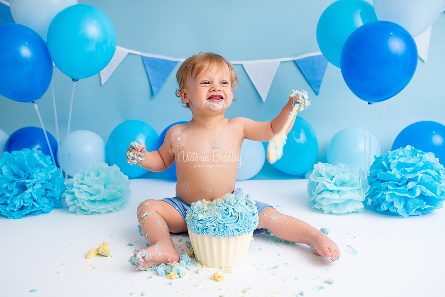 cake smash with baby boy and wooden spoon