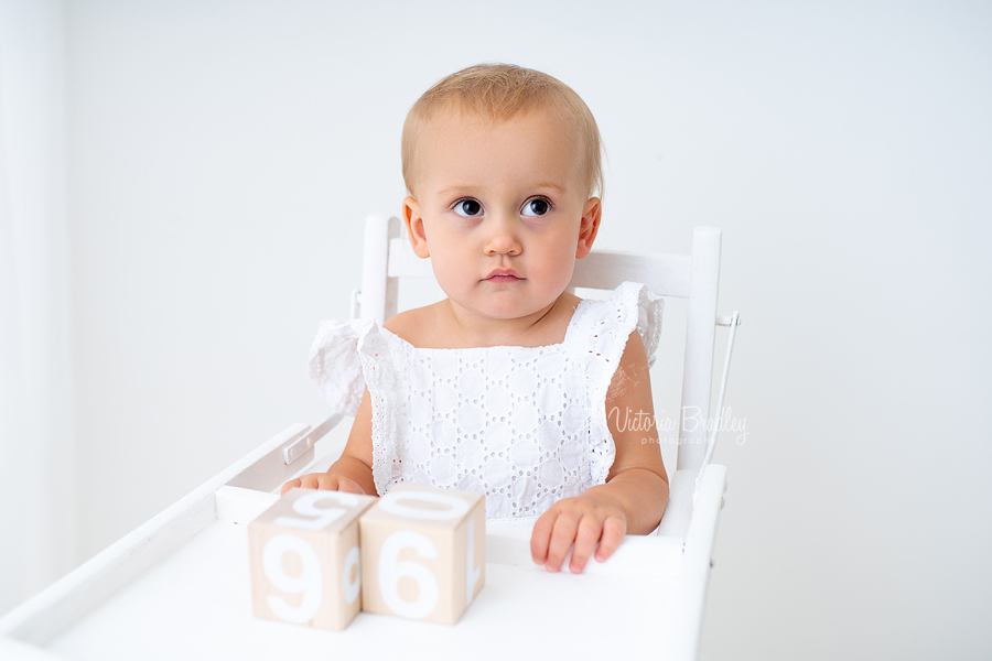 baby in white high chair