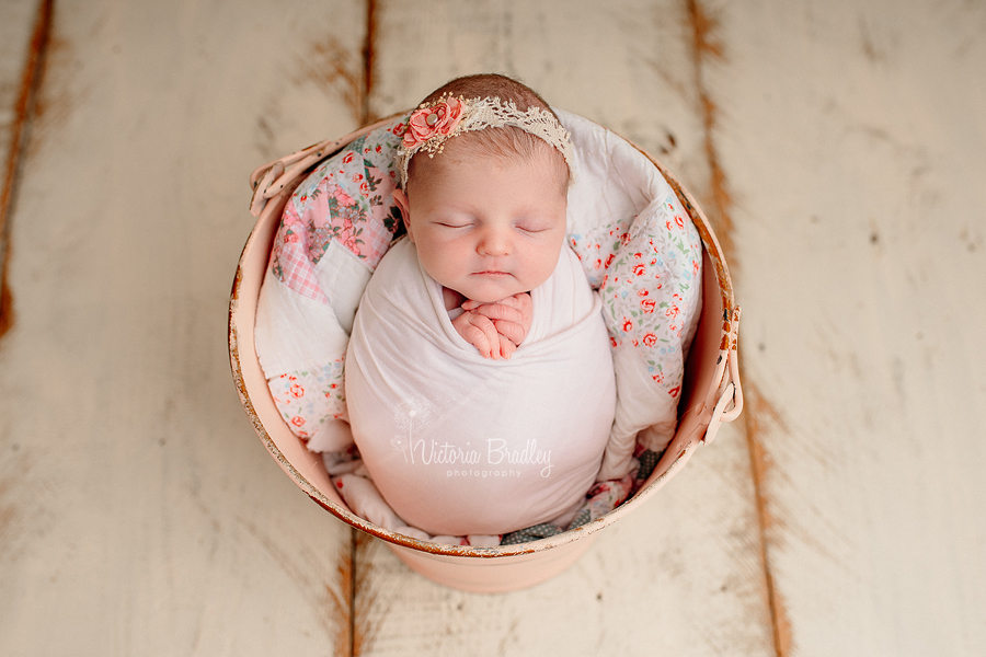 wrapped newborn in bucket