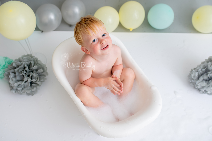 2 year old boy cake smash in white tub