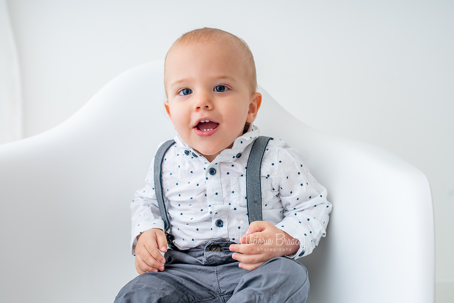 baby on white chair 