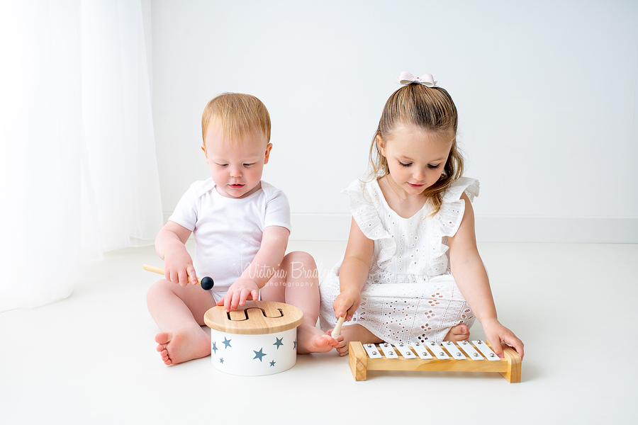 white room photography brother and sister