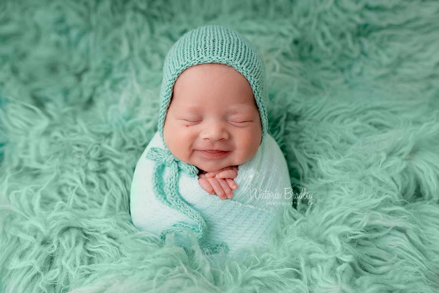 wrapped newborn in mint wrap