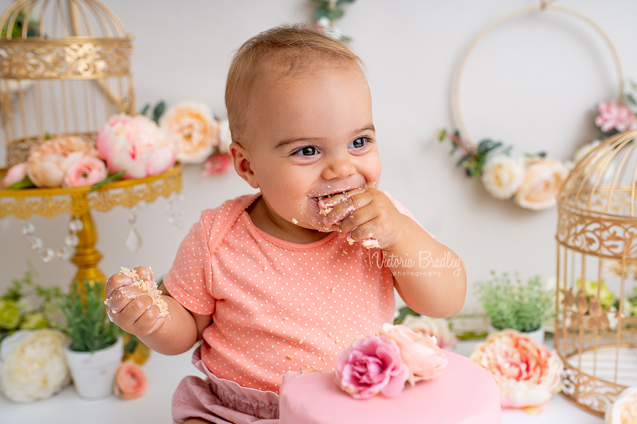 baby girl eating cake