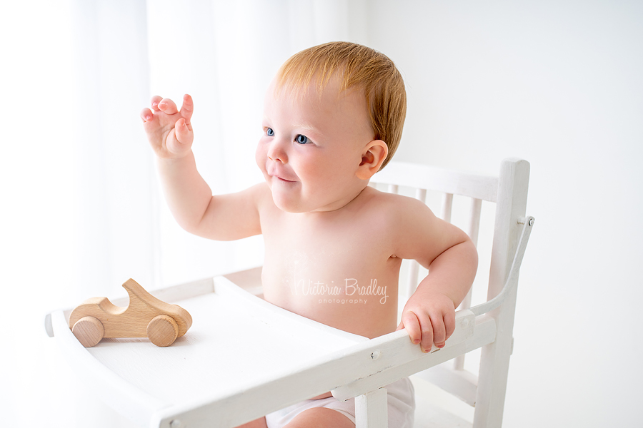 baby in white high chair