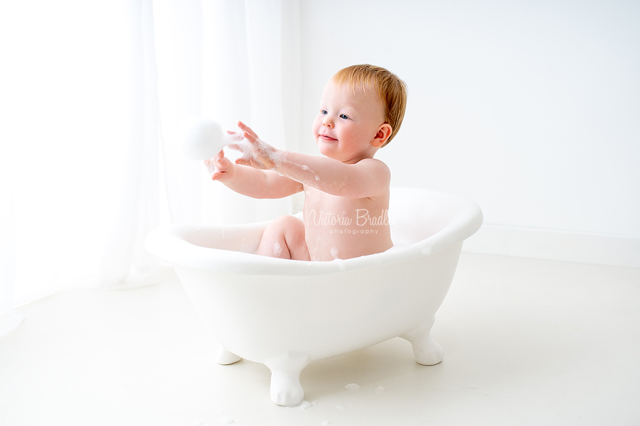 baby in white bath tub cake smash