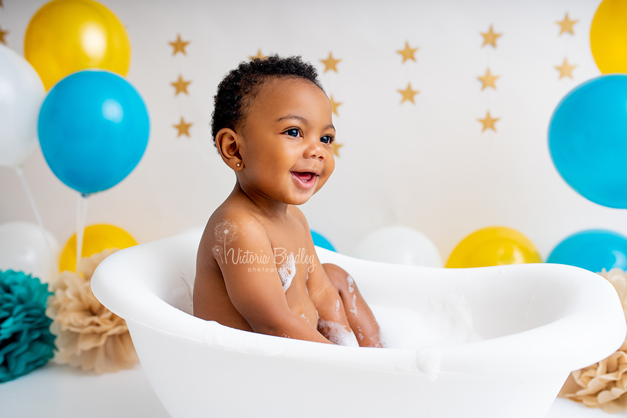 baby boy in white roll top mini bath tub cake smash photography