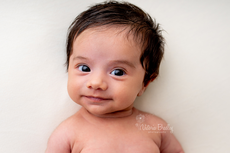 5 week old smiling newborn