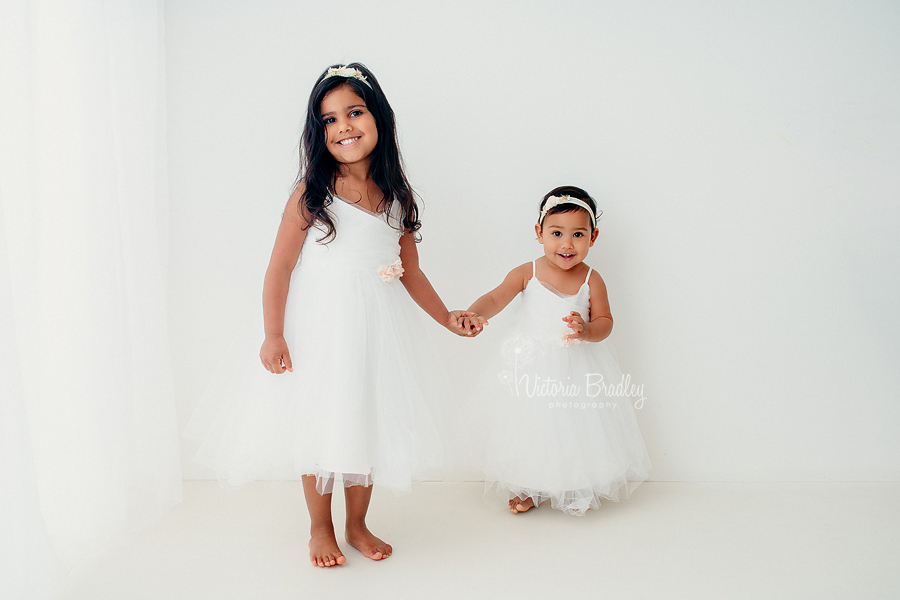 sisters white studio photography 