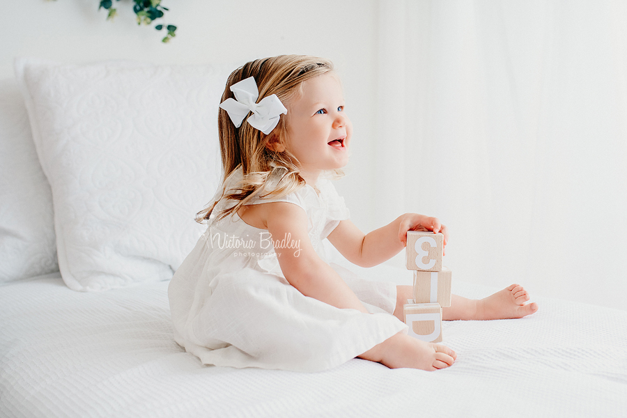 toddler photography white bed set up