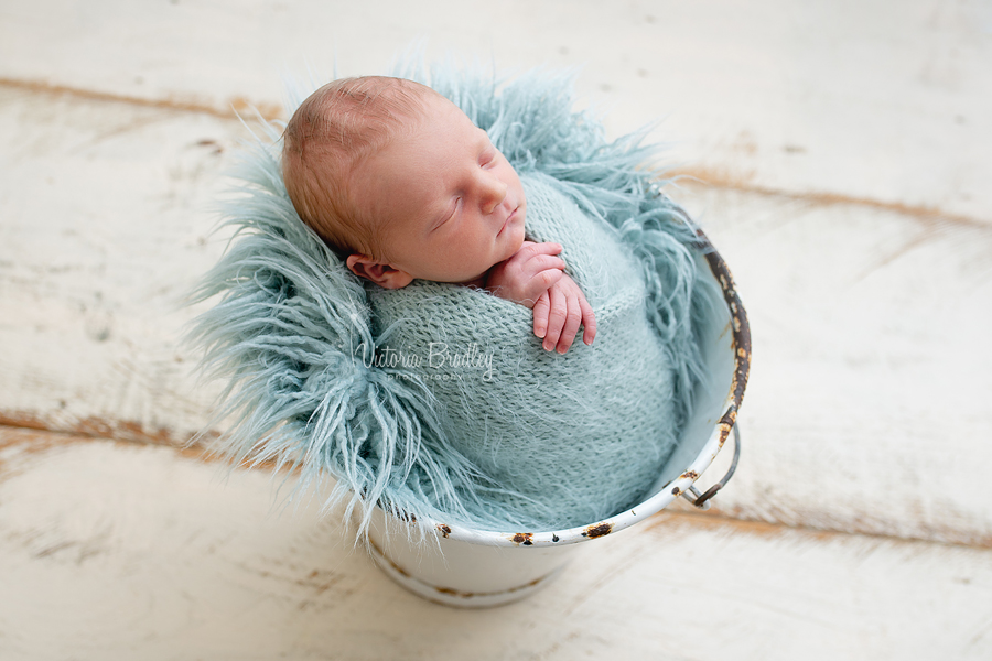 baby in a bucket