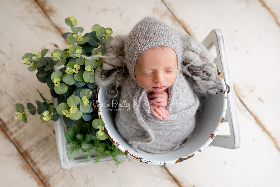 wrapped newborn in bucket