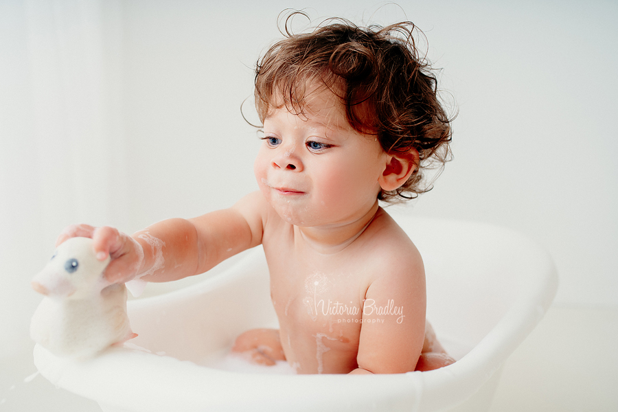 baby boy with rubber ducky