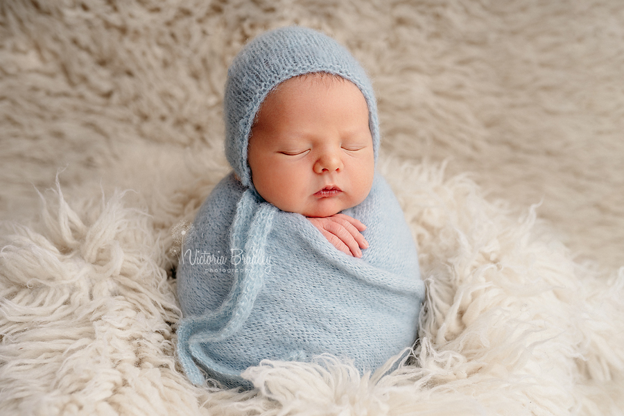 potato sack pose newborn in duck egg wrap