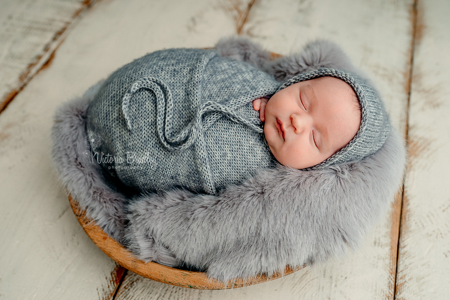 wrapped baby in grey